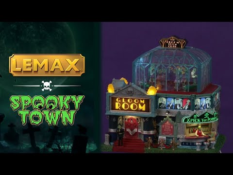 Resin lighted building for a Lemax Spooky Town display. Designed to look like an art deco themed dance club. There's a red carpet and a red velvet rope. There's a bar on the outside that reads "x PICK YER POISON x." There's a monster behind the bar and a woman sitting on a stool. There's a glass dome on top where you can see all the people dancing inside.