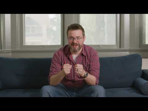 This image shows a man trying to one-up his Christmas decorations to upstage his neighbor.