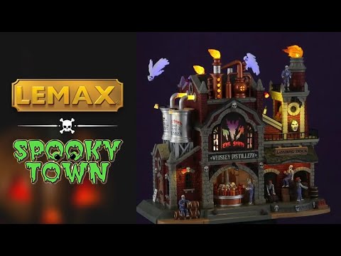 Polyresin lighted building for a Lemax Spooky Town display. Designed to look like a brick factory with gold machinery and silver barrels of whiskey. There are ghosts flying above the building and zombies on the loading dock.