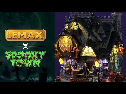Resin lighted building for a Spooky Town display. Designed to look like a brewery with pumpkin accents everywhere. There are monsters all over, drinking.