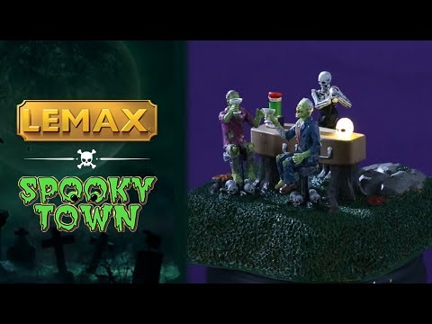 Resin village accent for a Lemax display. Designed to look like a skeleton serving drinks to two monsters. The "bar" is a coffin with a blender on it. The two monsters are sitting on stools with skulls and rats at the bottom.