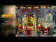 Resin lighted building for a Lemax display. Designed to look like a stone castle decorated for a Christmas gala with Santa. There are people dancing on the balcony and decorative nutcrackers. There are decorated Christmas trees, a snowman and red/white striped candle lights outside.