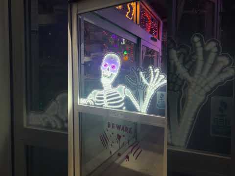 This is a video showing the skeleton decoration set up on a window.