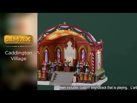 Resin lighted building for a Lemax display. Designed to look like a choir performing at a pavilion. There's a large organ, kids dressed like elves, two dogs, two peppermint candy cane accents, a decorated garland on the roof and a sign that reads "Joy to the World." The ceiling of the pavilion is decorated with different colored poinsettias.