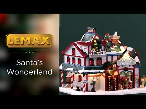 Resin lighted building for a Lemax display. Designed to look like a snow covered animal sanctuary. There are elves everywhere helping with the animals and helping to decorate a Christmas tree on the balcony.