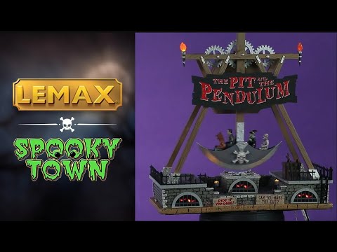 Polyresin and plastic table accent for a Lemax Spooky Town display. Designed to look like a pendulum carnival ride. The frame of the ride is wooden and there are metal gears at the top. There's a sign that reads "THE PIT AND THE PENDULUM." The ride is shaped like horseman's axe and there are four people on the ride: a werewolf, Frankenstein, a witch and skeleton. Underneath the ride is a bunch of stone walls with black windows with bars on them and creepy eyes lighting up.