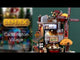 Plastic lighted building for a Lemax display. Designed to look like a large muffin shop. There's a large red windmill with a large muffin statue on the roof. The windmill reads "BANANA, CINNAMON, CHOCOLATE, BLUEBERRY."