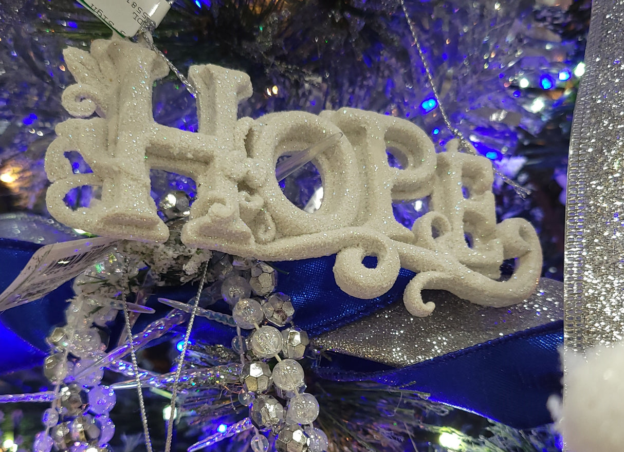 Ornaments read "LOVE" or "PEACE" or "JOY" or "HOPE."