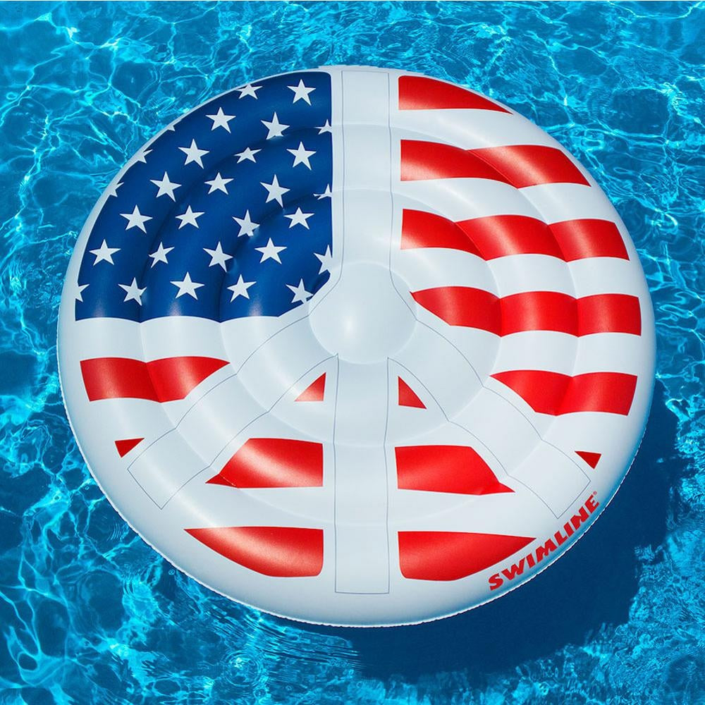 A pool float designed to look like a peace sign made out of the American flag.
