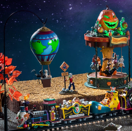 Lemax display that looks like a carnival. There's a train, a hot air balloon and a merry-go-round.