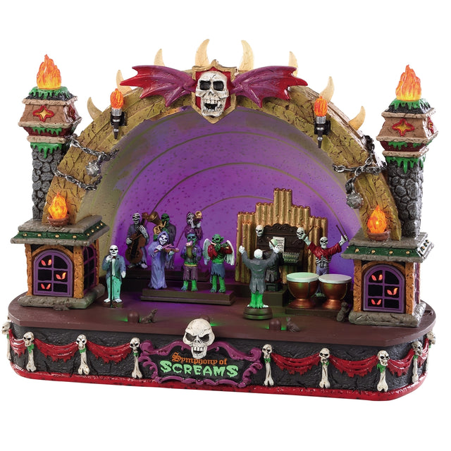 Polyresin building for a Lemax display. Designed to look like a conductor directing a symphony of monsters playing instruments on a stage decorated with bones, flames and skulls.