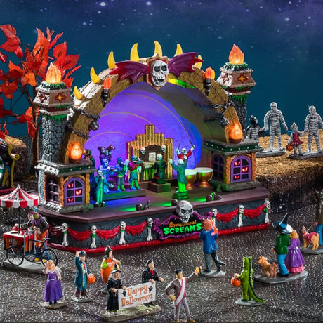 Polyresin building for a Lemax display. Designed to look like a conductor directing a symphony of monsters playing instruments on a stage decorated with bones, flames and skulls.