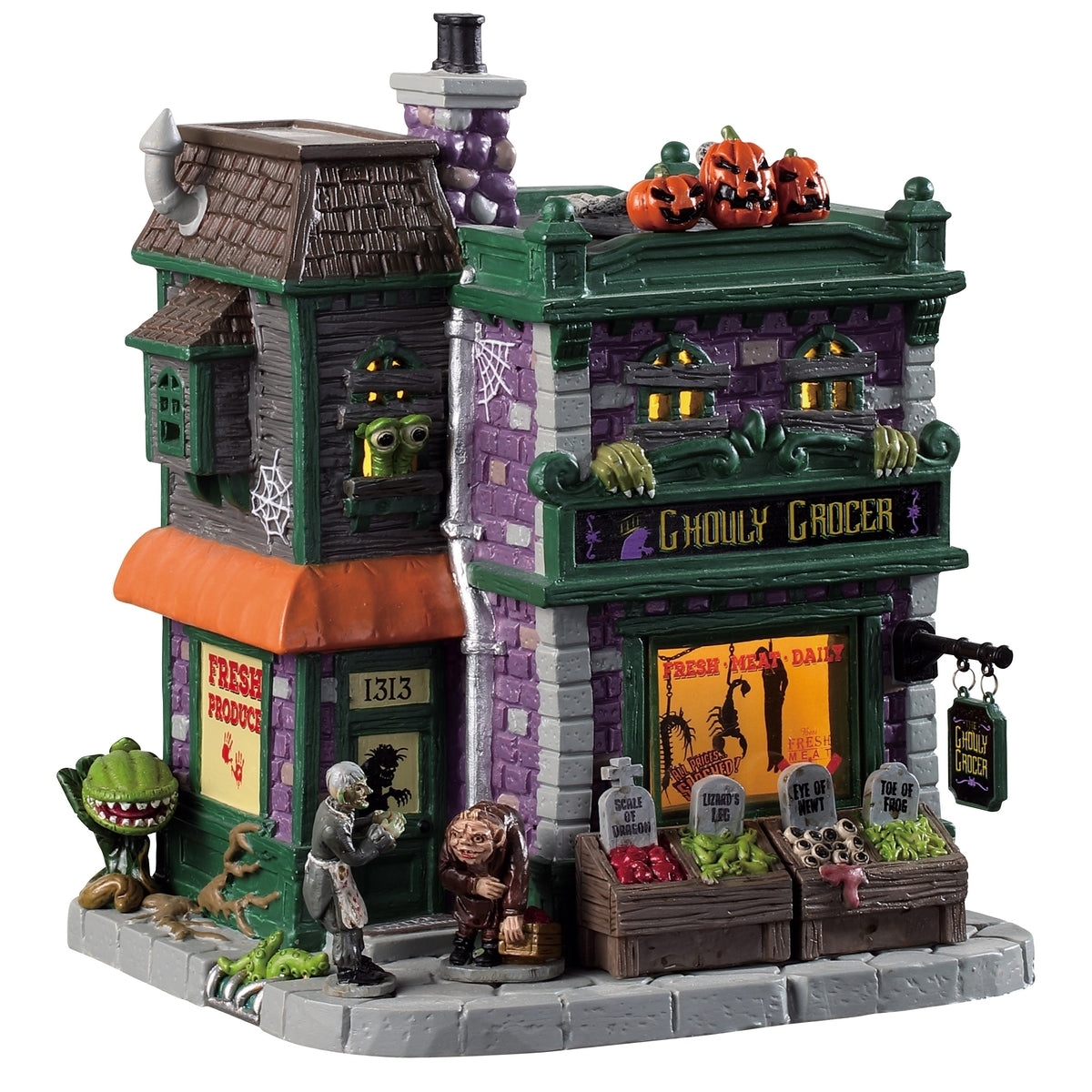 Porcelain lighted building for a Lemax display. Designed to look like a brick grocery store. There are monsters at the front door and boxes of stuff you can buy near the front window. Inside the window, you can see some creepy crawlies hanging from hooks. There are carved pumpkins on the roof.