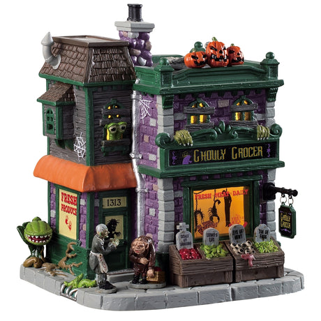 Porcelain lighted building for a Lemax display. Designed to look like a brick grocery store. There are monsters at the front door and boxes of stuff you can buy near the front window. Inside the window, you can see some creepy crawlies hanging from hooks. There are carved pumpkins on the roof.