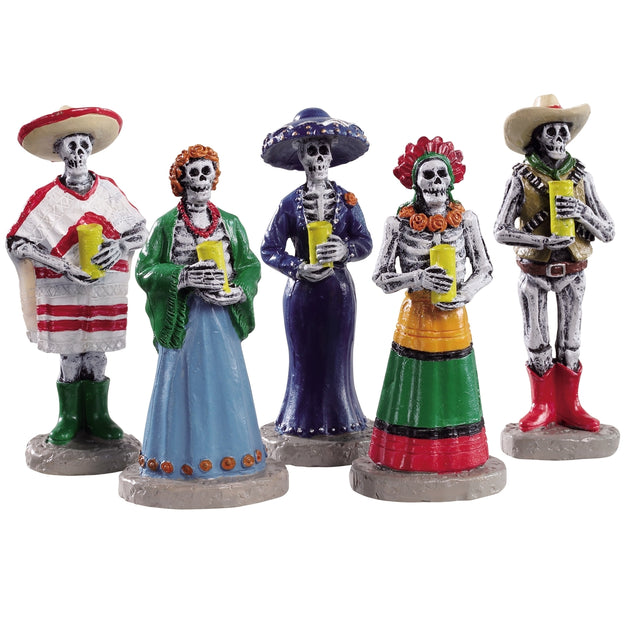 Polyresin figurines for a Lemax display. Designed to look like five skeletons dressed for a Dia De Los Muertos vigil and holding yellow candles.