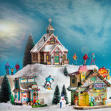 Village figurine for a Lemax display. Designed to look like a dad and son skiing down a hill together.