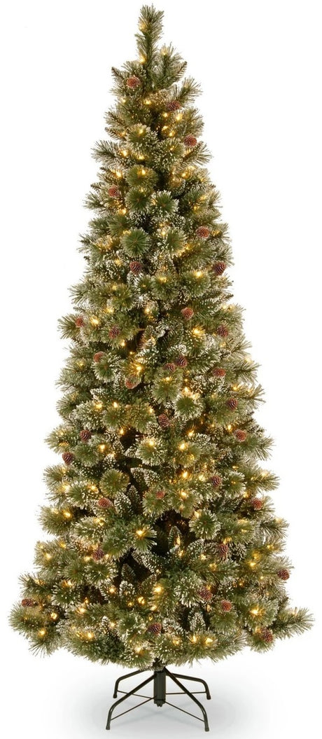 Pre-lit artificial tree with clear lights and pine cones.