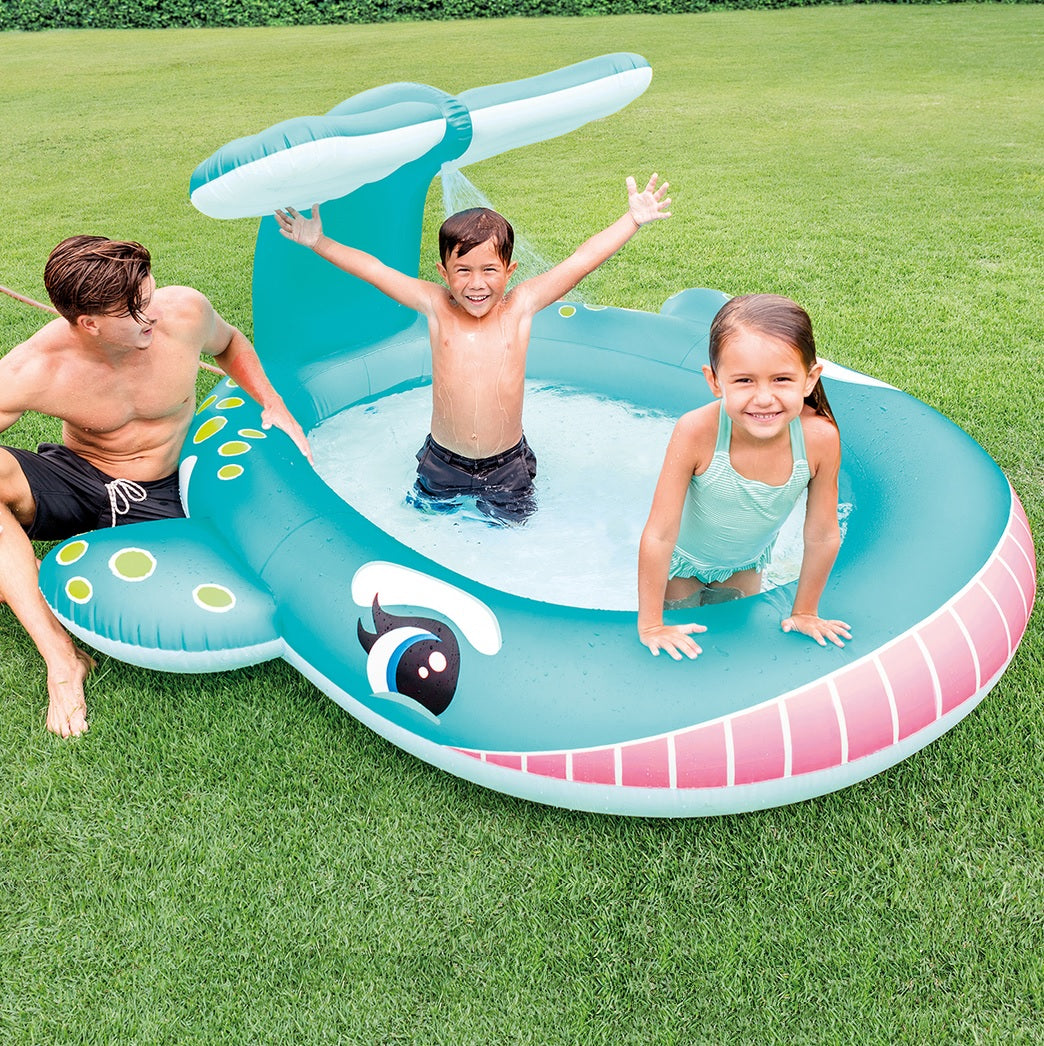 Inflatable pool for kids shaped like a cute, blue whale.