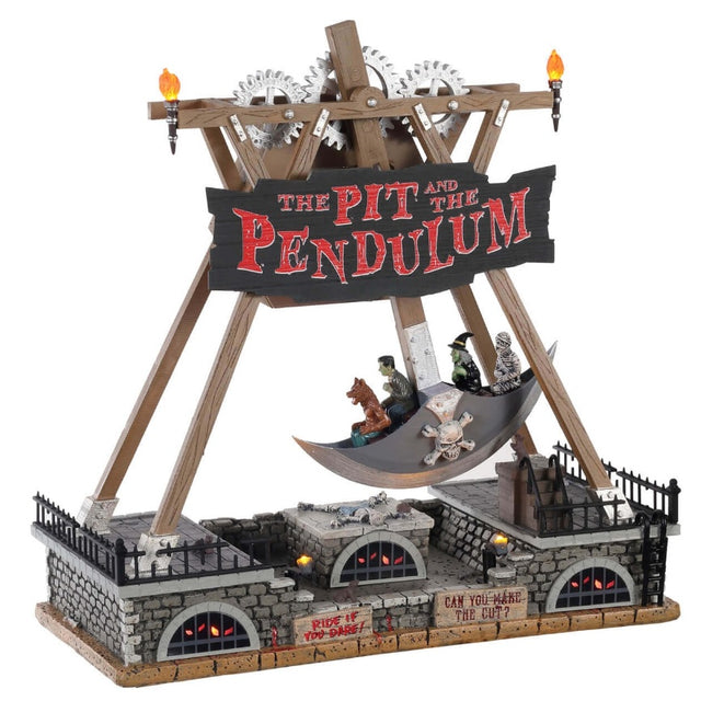 Polyresin and plastic table accent for a Lemax Spooky Town display. Designed to look like a pendulum carnival ride. The frame of the ride is wooden and there are metal gears at the top. There's a sign that reads "THE PIT AND THE PENDULUM." The ride is shaped like horseman's axe and there are four people on the ride: a werewolf, Frankenstein, a witch and skeleton. Underneath the ride is a bunch of stone walls with black windows with bars on them and creepy eyes lighting up.