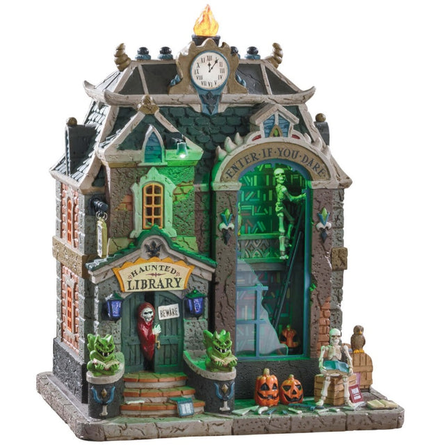 Porcelain lighted building for a Lemax display. Designed to look like an old, brick library. There's a grim reaper peeking out from the front door. Inside the large window, you can see a skeleton on a ladder looking through bookshelves. On the front by the door, there are two monster statues, some carved pumpkins and a skeleton sitting on a barrel.