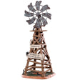 Polyresin table accent for a Lemax display. Designed to look like a wooden windmill with metal blades. There are two signs on it that read "DANGER!" and "BEWARE OF FALLING BLADES!" The danger sign has a small owl sitting on it. The beware sign has a big, black spider on it. There's a little bit of grass and dirt on the ground underneath it. There's a small rat standing at the bottom.
