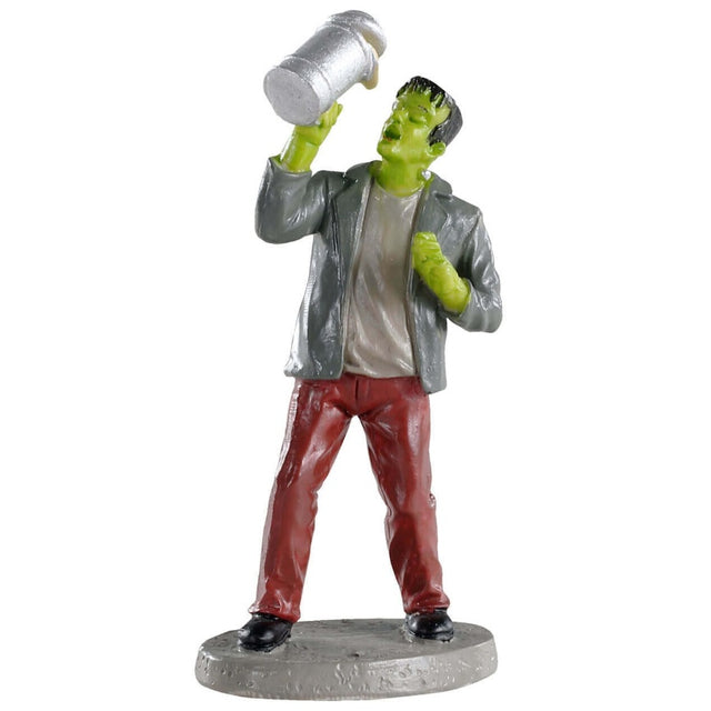 Polyresin figurine for a Lemax Spooky Town village display. Designed to look like Frankenstein chugging beer from a mug. He's wearing a gray suit jacket, a tan-ish shirt and red pants.
