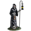 Polyresin figurine for Lemax Spooky Town display. Designed to look like the Grim Reaper. It's a skeleton wearing a big, black cloak and holding keys and a pole with a lantern on it. His eyes are red and he's standing on a patch of grass. There's a skull on the grass.