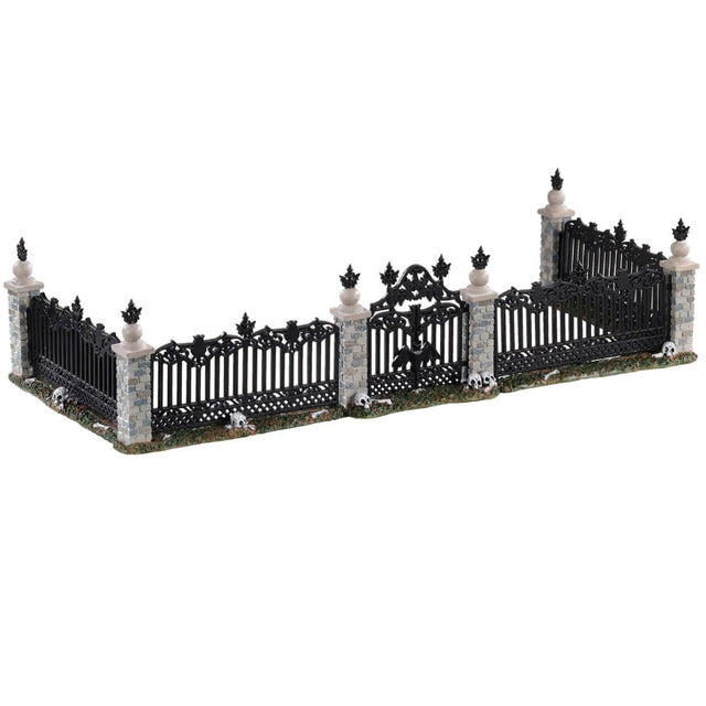 Polyresin village accent for a Lemax display. Designed to look like a black metal fence with stone columns and a black gate.