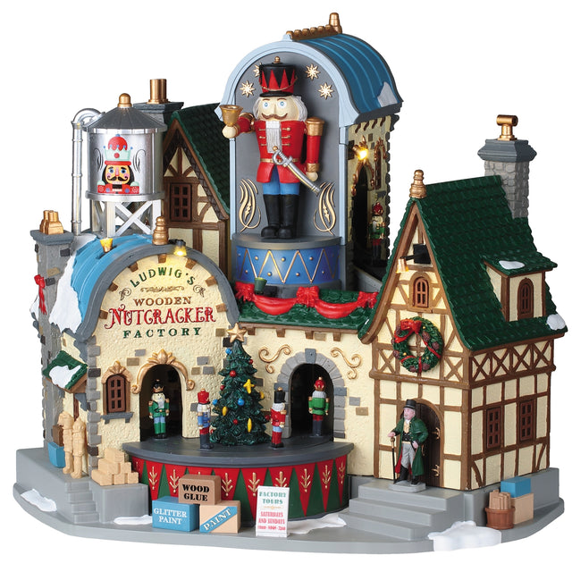 Polyresin lighted building for a Lemax Village display. The sign reads "Ludwig's Wooden Nutcracker Factory." There's a big nutcracker on the top of the building
