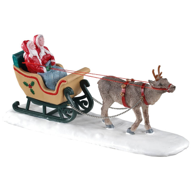 Polyresin figurine for a Lemax Village tabletop display. Designed to look like a reindeer pulling Santa and Mrs. Claus in a sleigh on snow