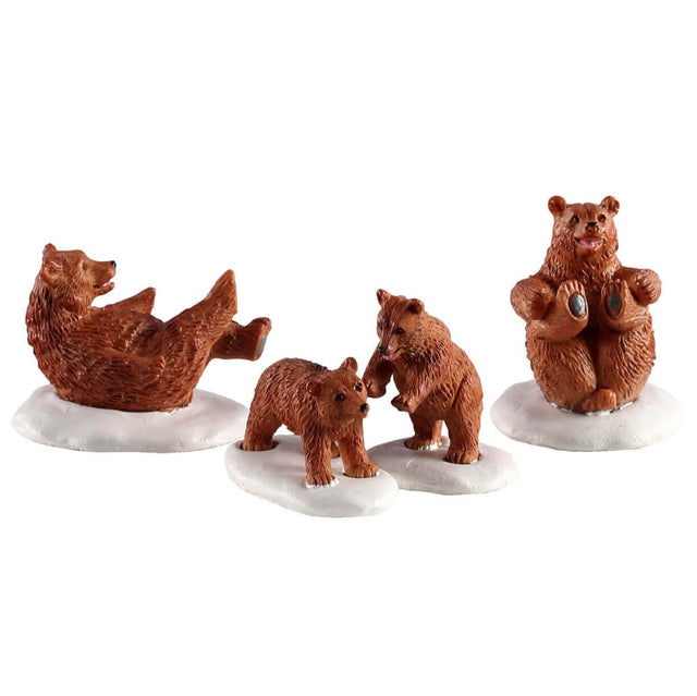 Polyresin figurines for a Lemax Village tabletop display. Designed to look like a family of four bears playing in the snow
