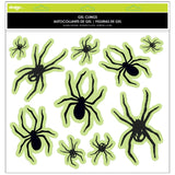 Glow in the dark window cling decorations for Halloween. One set reads "Happy Halloween" and features jack-o-lanterns and stars. One set features a bunch of different sized spiders. One set features a skull and cross bones with lightning. One set reads "Trick or Treat."