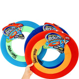 Lightweight frisbee made of colored spandex. There are three color options in this picture. One has a dark blue border, a light blue inner ring and the middle is missing so it flies further. The other one has a red border, an orange inner ring and the middle is missing so it flies further. The third one has a turquoise border, a neon green inner ring and the middle is missing. This picture shows one hand holding all three options.