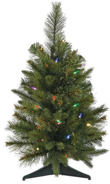 Small tabletop artificial tree pre-lit with multi-colored lights.