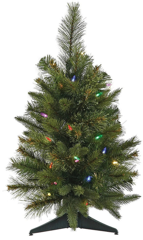 Small tabletop artificial tree pre-lit with multi-colored lights.