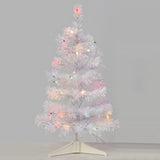 Small white tree pre-lit with multi-colored lights.