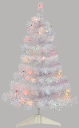 Small white tree pre-lit with multi-colored lights.