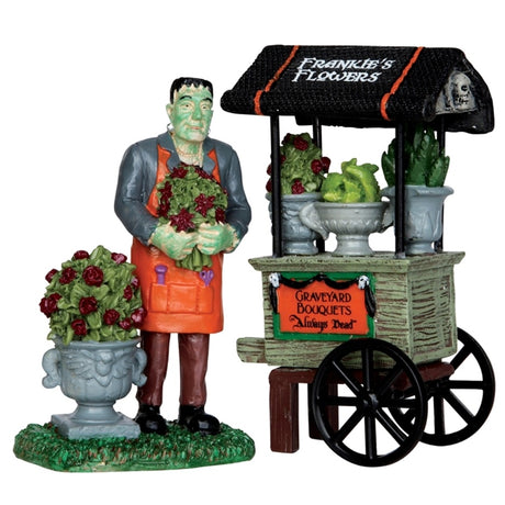 Polyresin figurines for a Lemax Spooky Town display. Designed to look like Frankenstein selling flowers out of a cart.