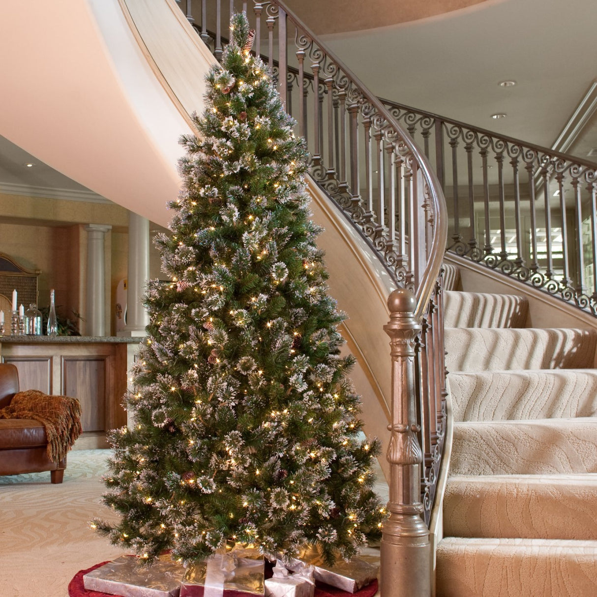 Artificial tree with white glitter on the branches. Pre-lit with clear lights.