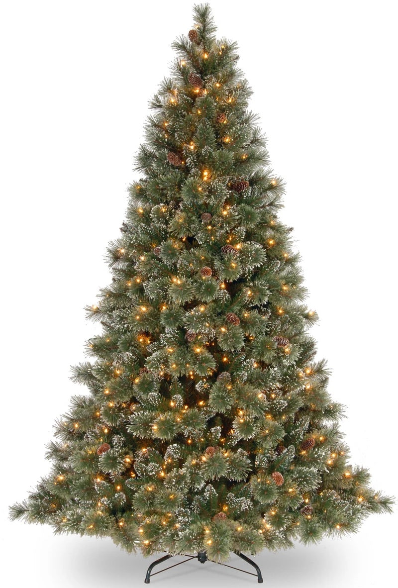 Artificial tree with white glitter on the branches. Pre-lit with clear lights.