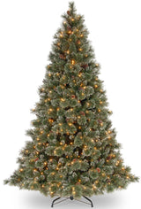 Artificial tree with white glitter on the branches. Pre-lit with clear lights.