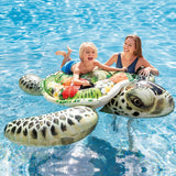 Inflatable pool float shaped like a turtle. This one's shell has tropical flowers on it.