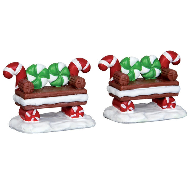 Polyresin figurines for a Lemax display. Designed to look like two benches made out of cookies, peppermint candies and Tootsie Rolls.