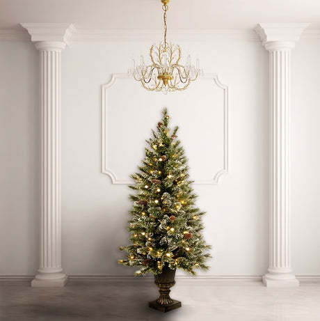 Pre-lit tree in a pot. The branches are covered in white glitter and there are pine cone accents. The lights are clear.