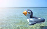 Inner tube for kids shaped like a penguin.