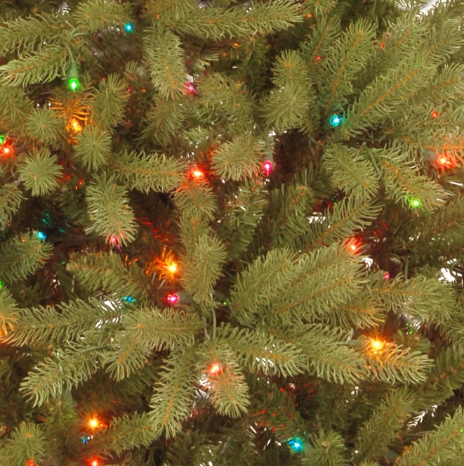Artificial tree pre-lit with multi-colored lights.
