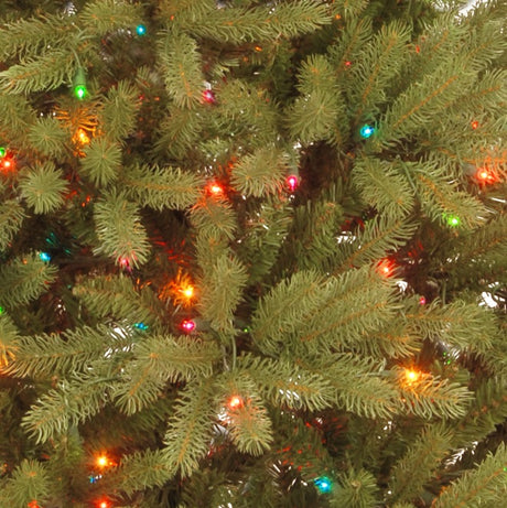 Artificial tree pre-lit with multi-colored lights.