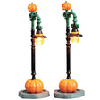Polyresin figures for a Lemax display. Designed to look like two lampposts decorated for Halloween. There are jack-o-lanterns on top and the lights are shaped like witch hats. The bases have a pumpkin.
