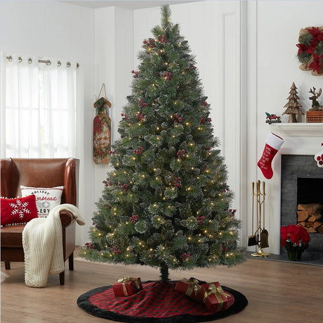Artificial tree pre-lit with dual lights. Lights change from clear to multi-colored lights. The tree also features red berries and white glitter.
