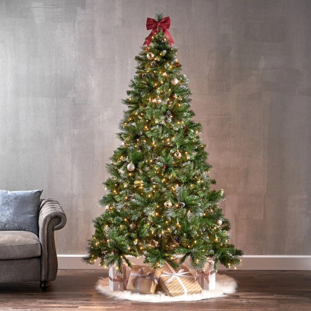 Artificial tree pre-lit with dual lights. Lights change from clear to multi-colored lights. The tree also features red berries and white glitter.